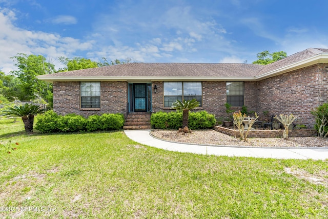 930 Ironridge Ct, Orange Park, FL 32065 - ranch-style home featuring brick siding, roof with shingles, and a front lawn