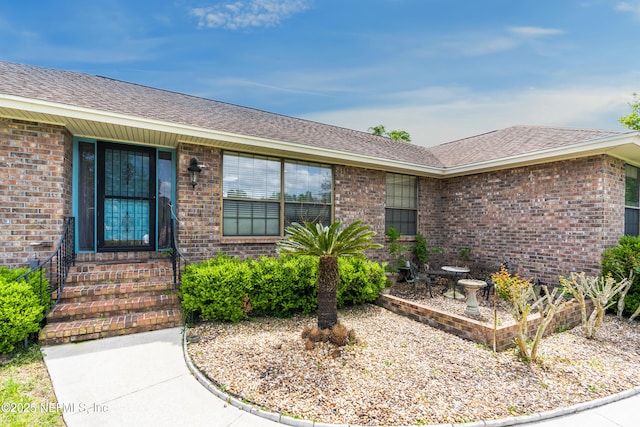 930 Ironridge Ct, Orange Park, FL 32065 - property entrance with brick siding and a shingled roof
