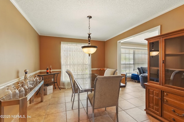 930 Ironridge Ct, Orange Park, FL 32065 - dining area with a textured ceiling, ornamental molding, and light tile patterned flooring