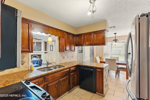 930 Ironridge Ct, Orange Park, FL 32065 - kitchen featuring a sink, visible vents, freestanding refrigerator, black dishwasher, and ceiling fan