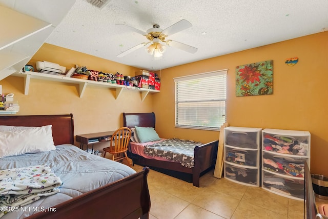 930 Ironridge Ct, Orange Park, FL 32065 - tiled bedroom featuring a ceiling fan, a textured ceiling, and visible vents