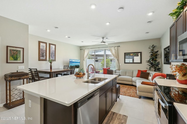 312 Anthony Dr, Jacksonville, FL 32218 - kitchen featuring range with electric stovetop, a ceiling fan, stainless steel dishwasher, a sink, and light countertops