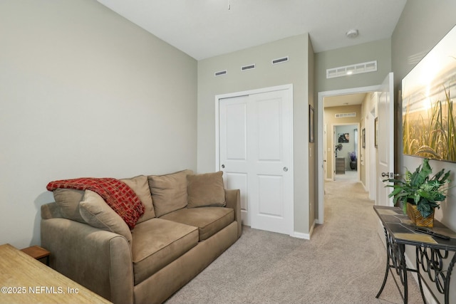 312 Anthony Dr, Jacksonville, FL 32218 - living area featuring baseboards, visible vents, and light carpet