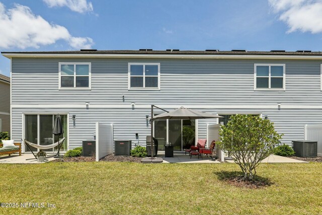 312 Anthony Dr, Jacksonville, FL 32218 - rear view of house with a yard, a patio, and central air condition unit