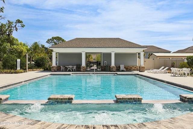 312 Anthony Dr, Jacksonville, FL 32218 - view of swimming pool with fence, a patio, and a pool with connected hot tub
