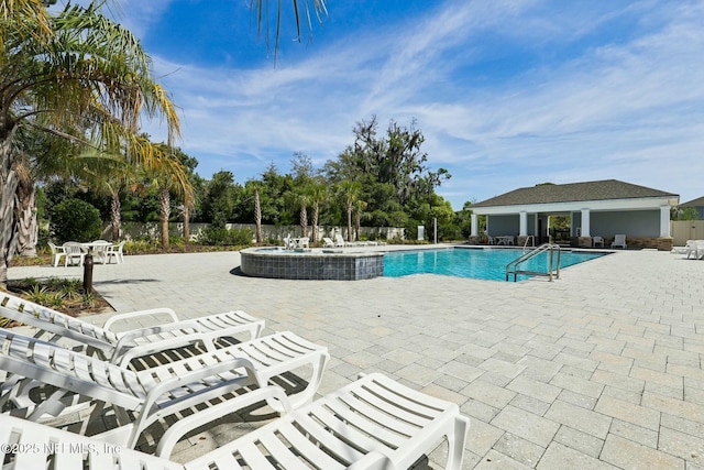 312 Anthony Dr, Jacksonville, FL 32218 - pool featuring a patio, fence, and a community hot tub