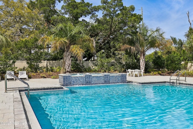 312 Anthony Dr, Jacksonville, FL 32218 - pool featuring fence, a jacuzzi, and a patio area