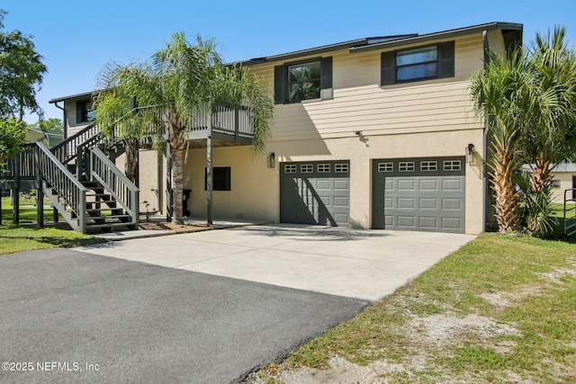 4068 Scenic Dr, Middleburg, FL 32068 - view of front of property with a garage, driveway, and stucco siding