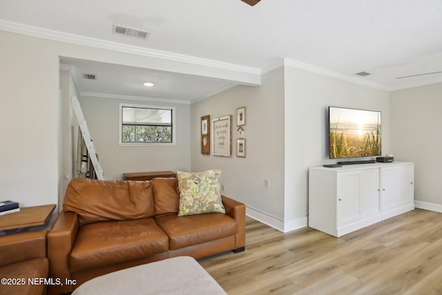 4068 Scenic Dr, Middleburg, FL 32068 - living area featuring light wood finished floors, visible vents, and crown molding