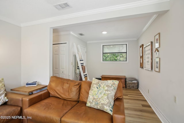 4068 Scenic Dr, Middleburg, FL 32068 - living area featuring baseboards, ornamental molding, wood finished floors, and visible vents