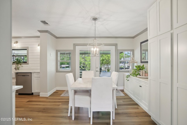 4068 Scenic Dr, Middleburg, FL 32068 - dining space with a chandelier, plenty of natural light, baseboards, and ornamental molding