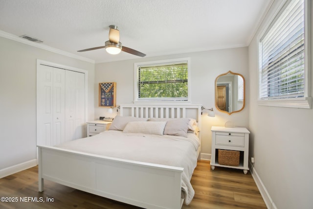 4068 Scenic Dr, Middleburg, FL 32068 - bedroom featuring a closet, wood finished floors, visible vents, and baseboards