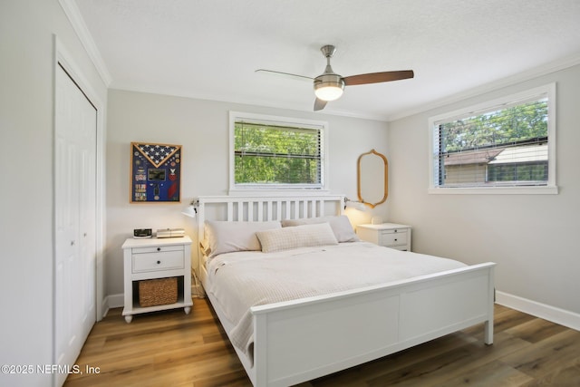 4068 Scenic Dr, Middleburg, FL 32068 - bedroom featuring wood finished floors, a closet, crown molding, and baseboards
