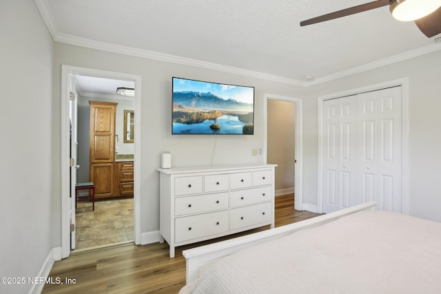4068 Scenic Dr, Middleburg, FL 32068 - bedroom with wood finished floors, a ceiling fan, ornamental molding, a closet, and baseboards