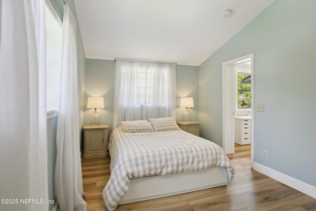 4068 Scenic Dr, Middleburg, FL 32068 - bedroom featuring lofted ceiling, baseboards, and wood finished floors