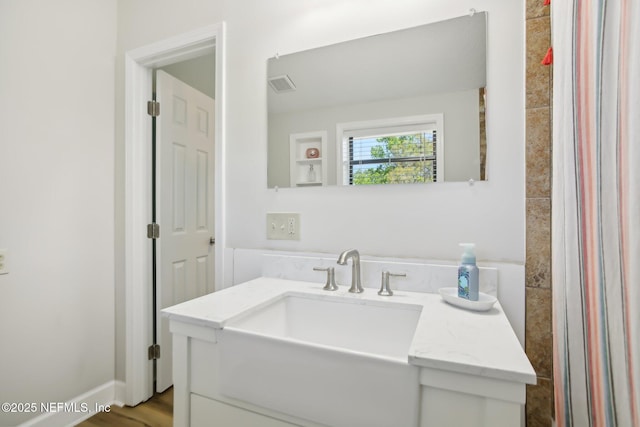4068 Scenic Dr, Middleburg, FL 32068 - bathroom featuring wood finished floors, visible vents, and vanity