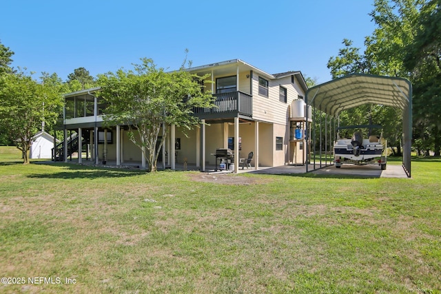 4068 Scenic Dr, Middleburg, FL 32068 - back of house with stairs, stucco siding, a wooden deck, a carport, and a lawn