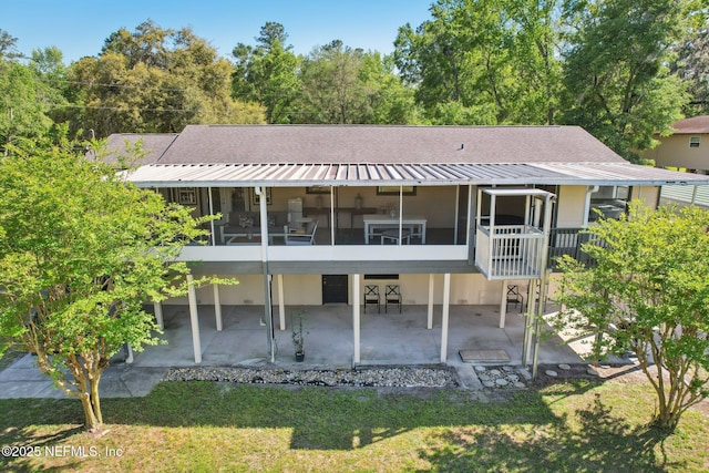 4068 Scenic Dr, Middleburg, FL 32068 - rear view of property featuring a yard, a sunroom, and a patio
