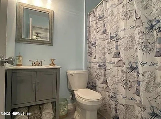 1422 Ellis Trace Dr, Jacksonville, FL 32205 - full bath featuring baseboards, vanity, curtained shower, and toilet