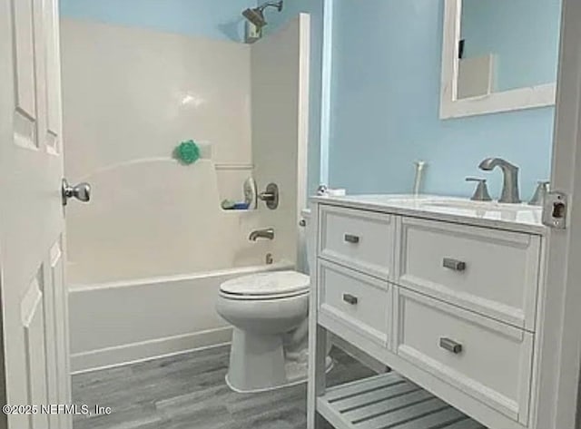 1422 Ellis Trace Dr, Jacksonville, FL 32205 - bathroom with wood finished floors, vanity,  shower combination, and toilet
