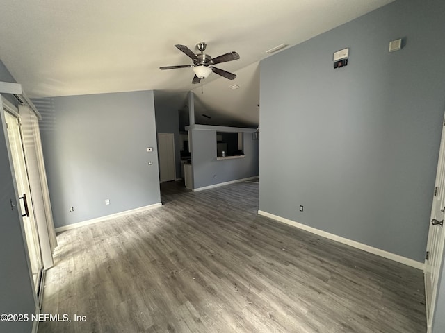 1422 Ellis Trace Dr, Jacksonville, FL 32205 - unfurnished living room featuring lofted ceiling, wood finished floors, visible vents, baseboards, and ceiling fan