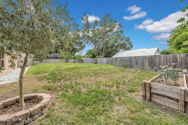 2925 Bradford St, Saint Augustine, FL 32084 - view of yard featuring a fenced backyard and a vegetable garden