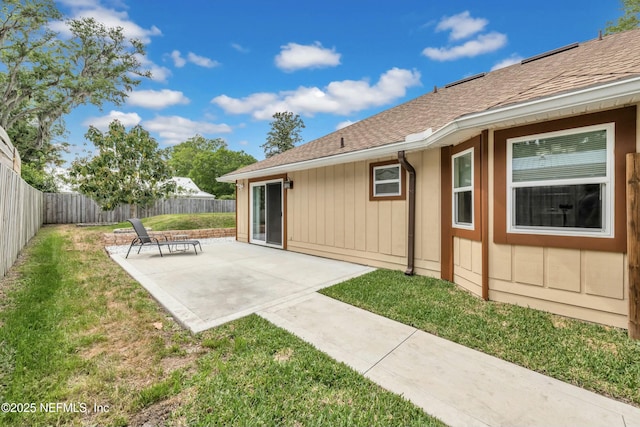 2925 Bradford St, Saint Augustine, FL 32084 - back of house with a lawn, a fenced backyard, roof with shingles, and a patio area