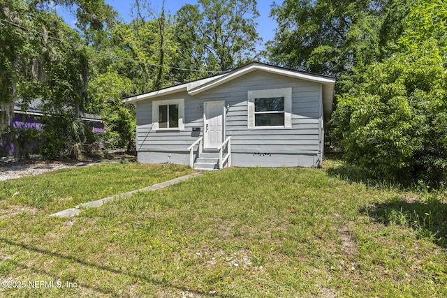 1585 W 31st St, Jacksonville, FL 32209 - view of front facade featuring entry steps and a front yard