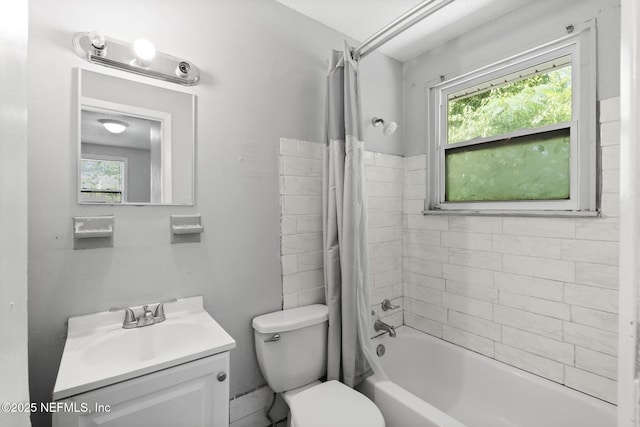 1585 W 31st St, Jacksonville, FL 32209 - full bath with toilet, vanity, shower / bathtub combination with curtain, and a healthy amount of sunlight