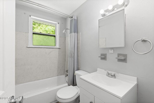 1585 W 31st St, Jacksonville, FL 32209 - bathroom featuring shower / bath combo, toilet, and vanity