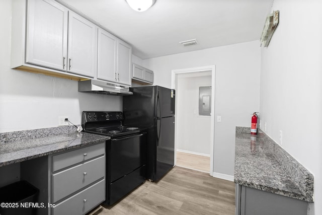 1585 W 31st St, Jacksonville, FL 32209 - kitchen with visible vents, gray cabinetry, under cabinet range hood, and black appliances