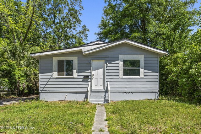 1585 W 31st St, Jacksonville, FL 32209 - view of front of home featuring a front lawn