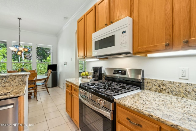 kitchen featuring brown cabinetry, a notable chandelier, ornamental molding, and stainless steel appliances