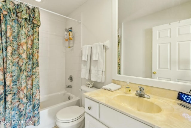 full bathroom featuring toilet, vanity, and shower / bathtub combination with curtain
