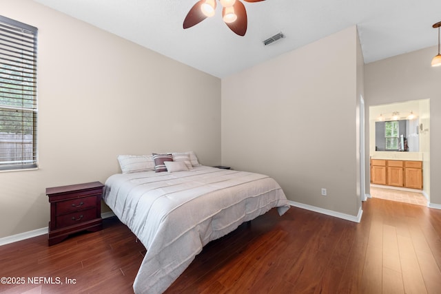 bedroom featuring a ceiling fan, baseboards, visible vents, and wood finished floors