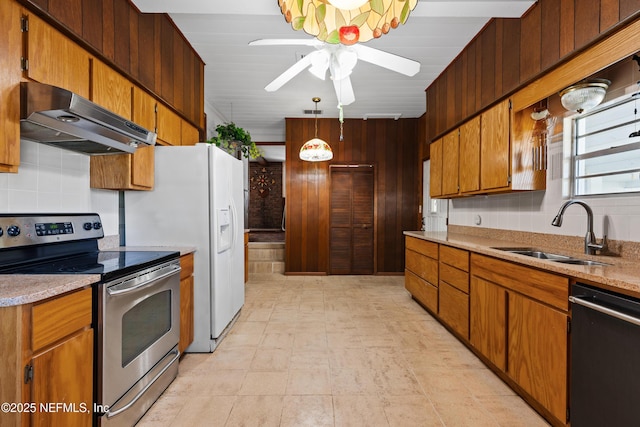 kitchen featuring a ceiling fan, a sink, electric range, under cabinet range hood, and dishwashing machine