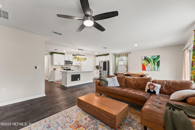 11476 Sheepshead Ln, Jacksonville, FL 32226 - living room featuring dark wood-type flooring, ceiling fan, baseboards, and recessed lighting