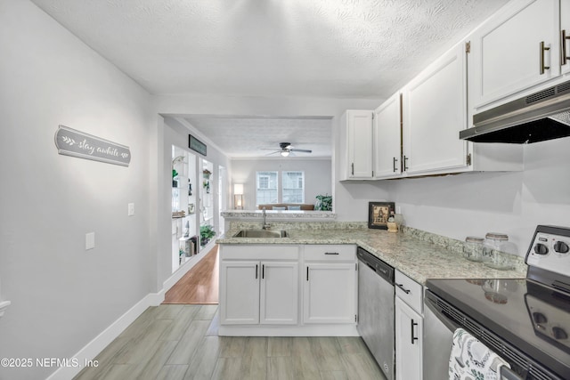 kitchen featuring a sink, white cabinetry, appliances with stainless steel finishes, and under cabinet range hood