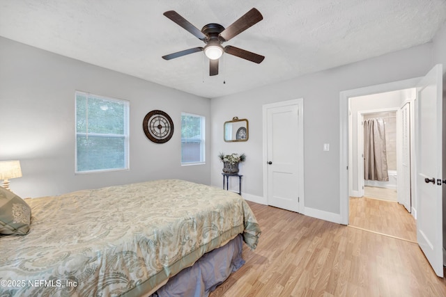 bedroom featuring baseboards, ceiling fan, and light wood finished floors