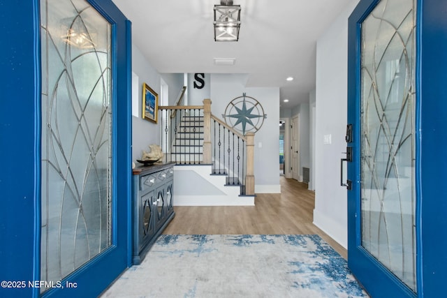 548 Sea Island Dr, Fernandina Beach, FL 32034 - entryway featuring stairs, wood finished floors, baseboards, and recessed lighting