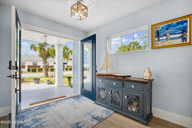 548 Sea Island Dr, Fernandina Beach, FL 32034 - doorway featuring wood finished floors and baseboards