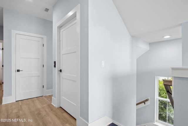 548 Sea Island Dr, Fernandina Beach, FL 32034 - hallway featuring an upstairs landing, light wood-style floors, baseboards, and recessed lighting
