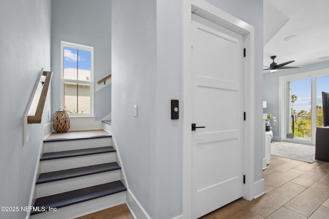 548 Sea Island Dr, Fernandina Beach, FL 32034 - stairs featuring plenty of natural light, a ceiling fan, and wood finished floors