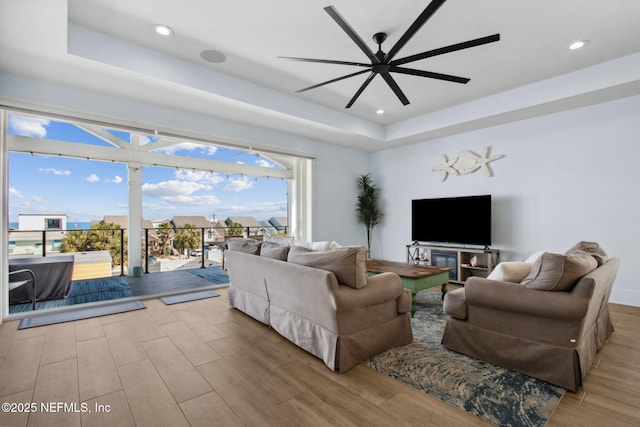 548 Sea Island Dr, Fernandina Beach, FL 32034 - living area featuring wood finished floors, a raised ceiling, ceiling fan, and recessed lighting