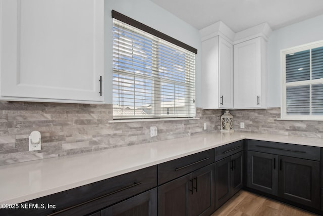 548 Sea Island Dr, Fernandina Beach, FL 32034 - kitchen with white cabinets, light countertops, and tasteful backsplash