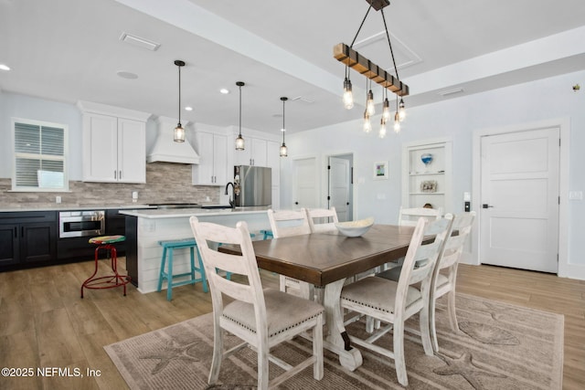 548 Sea Island Dr, Fernandina Beach, FL 32034 - dining space featuring light wood finished floors and recessed lighting