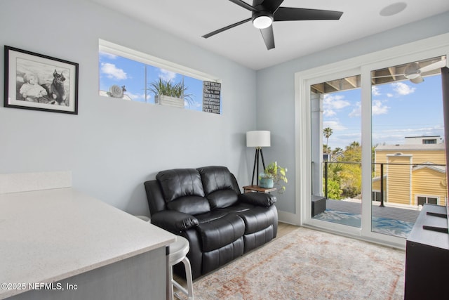 548 Sea Island Dr, Fernandina Beach, FL 32034 - living area with ceiling fan, wood finished floors, and baseboards
