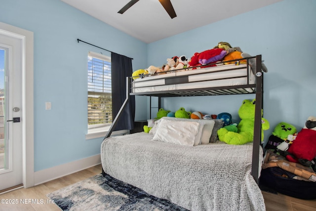 548 Sea Island Dr, Fernandina Beach, FL 32034 - bedroom featuring wood finished floors, baseboards, and a ceiling fan