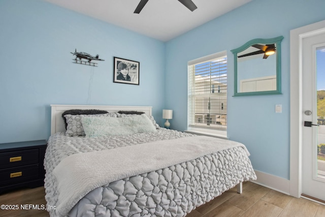 548 Sea Island Dr, Fernandina Beach, FL 32034 - bedroom with wood finished floors, ceiling fan, and baseboards