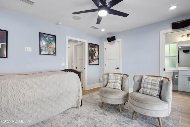 548 Sea Island Dr, Fernandina Beach, FL 32034 - bedroom featuring light wood-type flooring, ceiling fan, connected bathroom, and recessed lighting